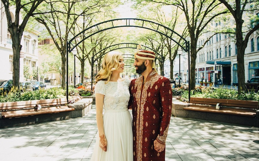 The couple poses in downtown’s Piatt Park.